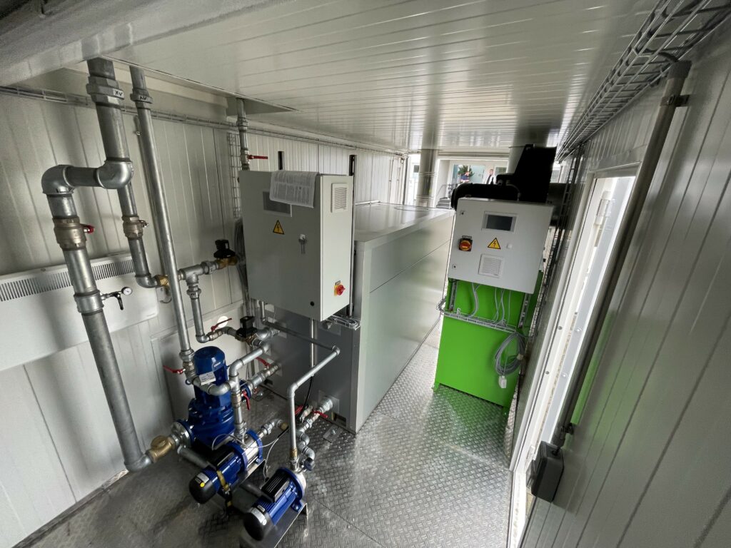 Combined heating air system for silo heating (right) and hot water system (left) in a container. Both plants can be operated independently of each other.