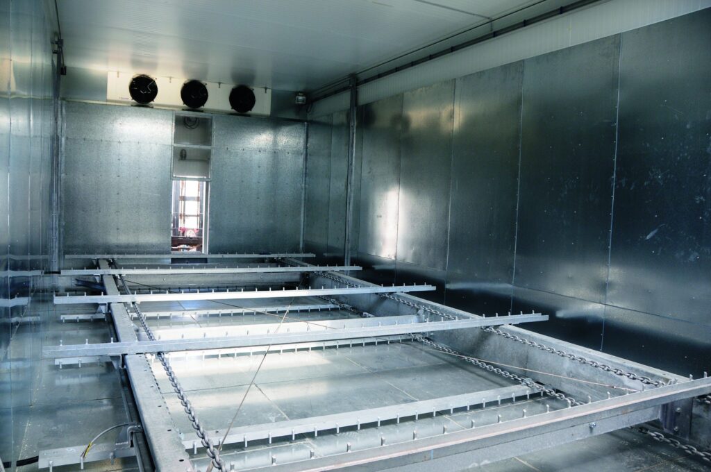 Interior view of a fully automatic ice storage system with rake system.